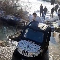 AJDE, JE L IMATE MU*A Srpski sveštenik zapalio društvene mreže: Džipom ušao u reku pa motivisao plivače (VIDEO)