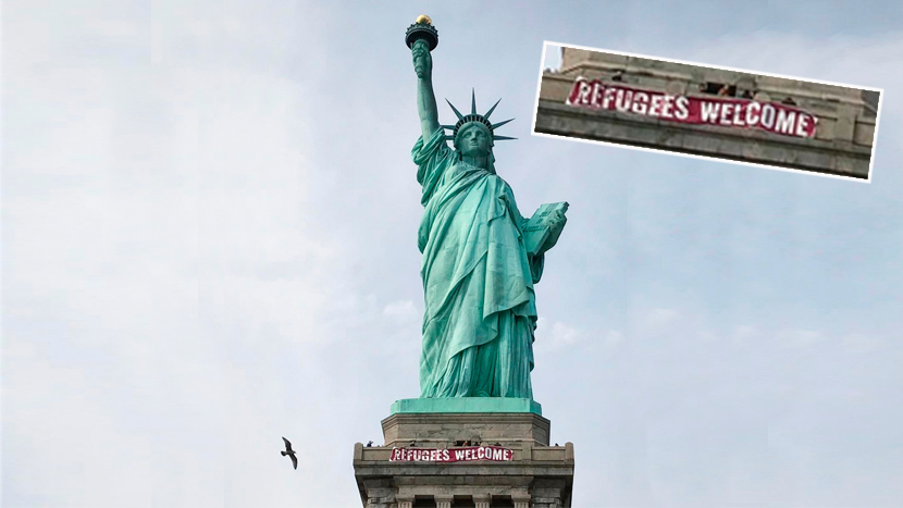 Na Kip slobode postavljen transparent “Izbeglice su dobrodošle” (FOTO)