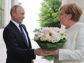 Putin Merkelovu dočekao s ružama, o čemu su razgovarali?