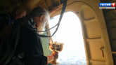 Rusija: Sveštenik vazduhoplovac posipa“ grad svetom vodicom